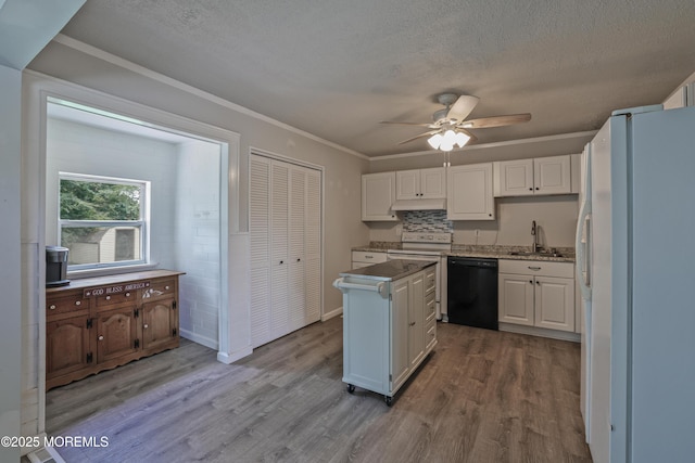 107 Seneca Lake Dr, Little Egg Harbor, NJ 08087 - kitchen with freestanding refrigerator, wood finished floors, a textured ceiling, white cabinets, and a ceiling fan