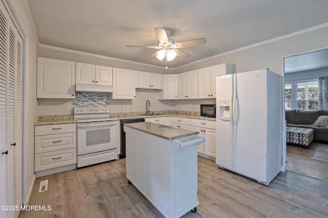 107 Seneca Lake Dr, Little Egg Harbor, NJ 08087 - kitchen featuring black appliances, light wood-type flooring, white cabinets, ceiling fan, and crown molding