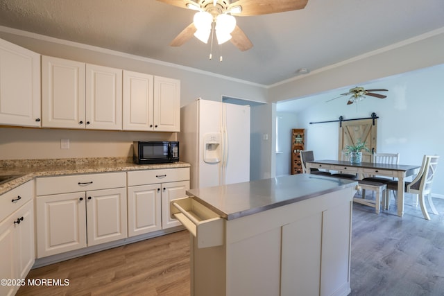 107 Seneca Lake Dr, Little Egg Harbor, NJ 08087 - kitchen with ceiling fan, light wood finished floors, white fridge with ice dispenser, a barn door, and white cabinets
