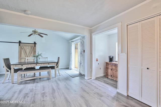 107 Seneca Lake Dr, Little Egg Harbor, NJ 08087 - dining area featuring a ceiling fan, wood finished floors, a barn door, and ornamental molding