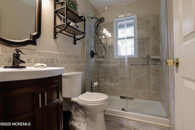 107 Seneca Lake Dr, Little Egg Harbor, NJ 08087 - bathroom with vanity, a shower stall, tile walls, and wood finished floors