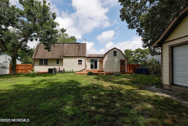 107 Seneca Lake Dr, Little Egg Harbor, NJ 08087 - rear view of house featuring a fenced backyard, a wooden deck, a gambrel roof, and a shingled roof