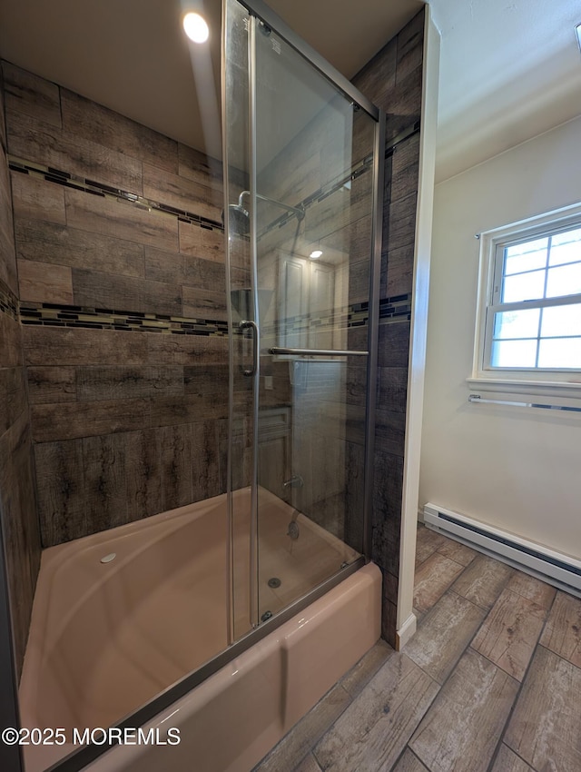 44J Cambridge Ct Unit 2010, Lakewood, NJ 08701 - full bath with a baseboard heating unit, enclosed tub / shower combo, and wood tiled floors