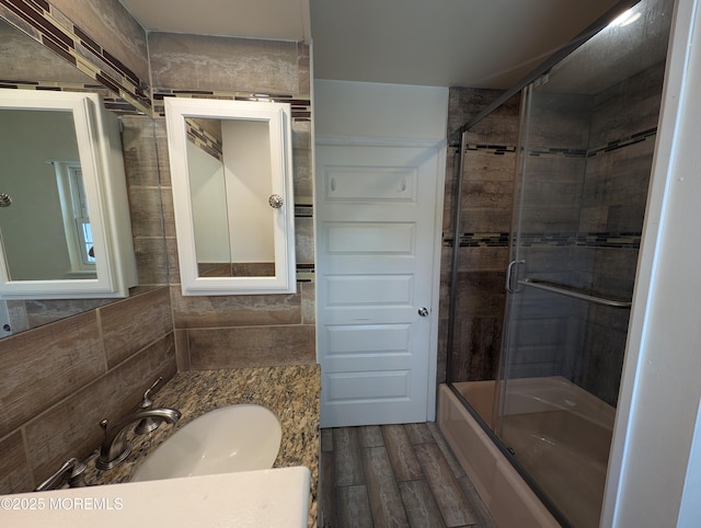 44J Cambridge Ct Unit 2010, Lakewood, NJ 08701 - bathroom featuring wood finished floors, vanity, and shower / bath combination with glass door