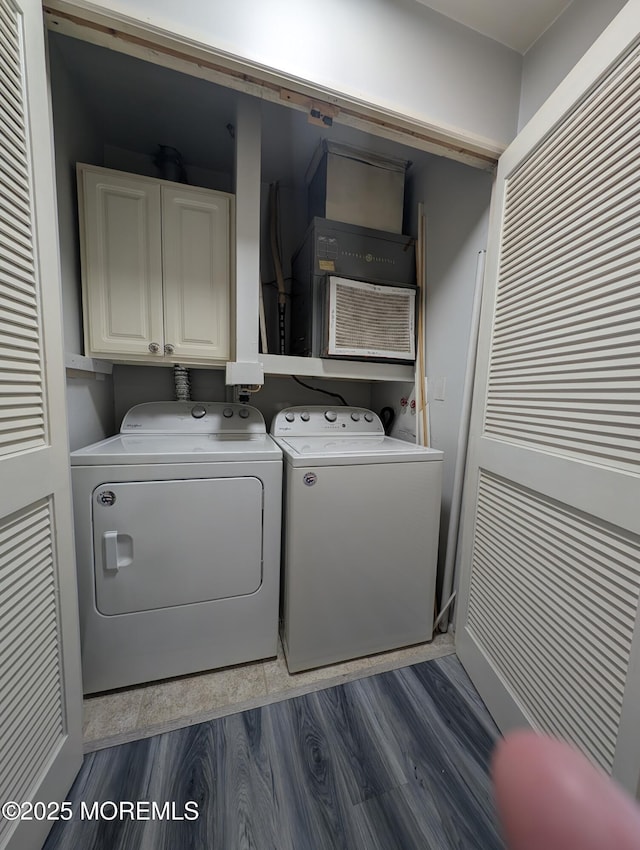 44J Cambridge Ct Unit 2010, Lakewood, NJ 08701 - laundry area featuring cabinet space, washer and dryer, and dark wood-type flooring