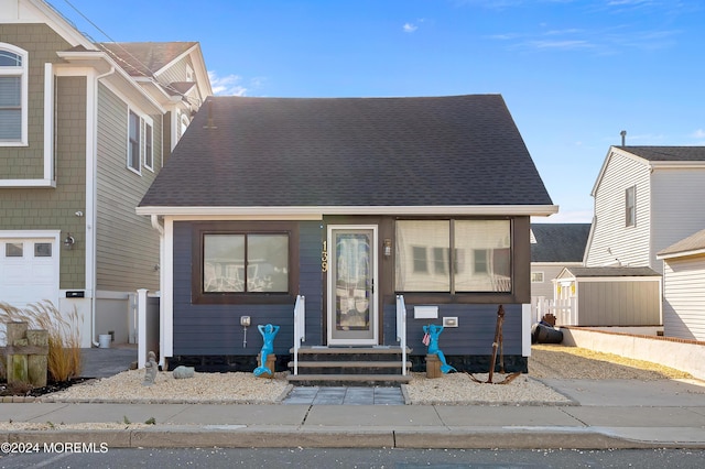139 N St, Seaside Park, NJ 08752 - view of front of property featuring a shingled roof and entry steps