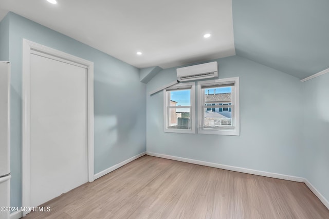 139 N St, Seaside Park, NJ 08752 - additional living space featuring wood finished floors, a wall mounted AC, recessed lighting, and vaulted ceiling