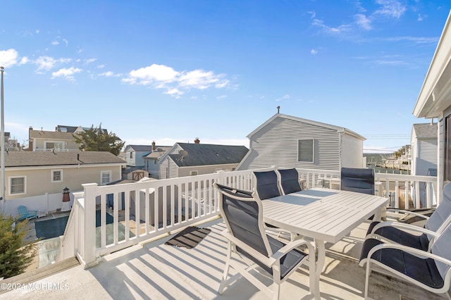 139 N St, Seaside Park, NJ 08752 - deck with outdoor dining area and a residential view