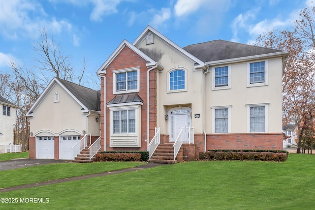 208 Imperial Ct, Lakewood, NJ 08701 - view of front facade with brick siding, driveway, a front lawn, and stucco siding