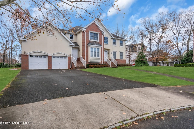 208 Imperial Ct, Lakewood, NJ 08701 - traditional home featuring brick siding, asphalt driveway, a front lawn, and stucco siding