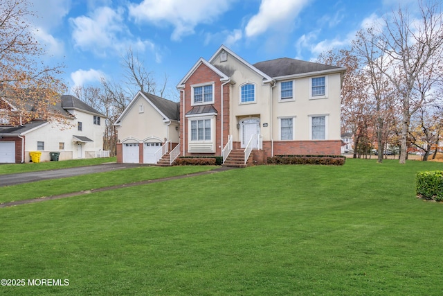 208 Imperial Ct, Lakewood, NJ 08701 - view of front of home with driveway, a front yard, stucco siding, and brick siding