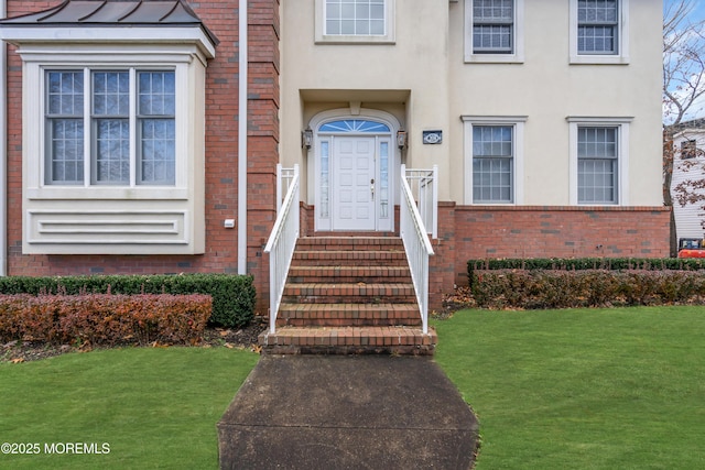 208 Imperial Ct, Lakewood, NJ 08701 - property entrance featuring brick siding, a lawn, and stucco siding