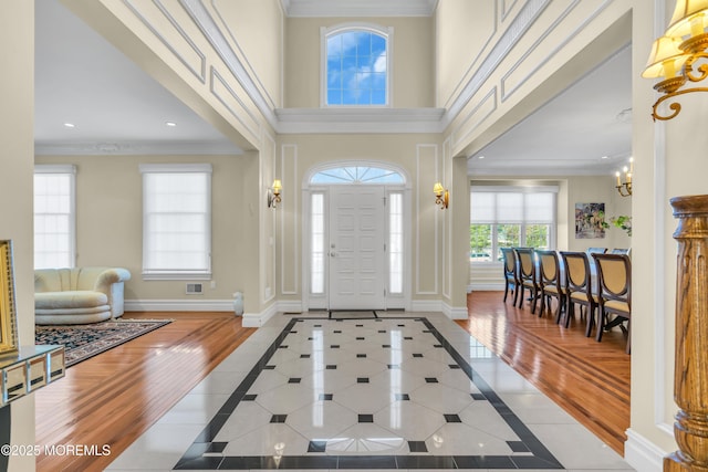 208 Imperial Ct, Lakewood, NJ 08701 - foyer with inlaid floor details, recessed lighting, crown molding, tile patterned floors, and a high ceiling