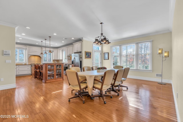 208 Imperial Ct, Lakewood, NJ 08701 - dining room with ornamental molding, light wood finished floors, a chandelier, and recessed lighting
