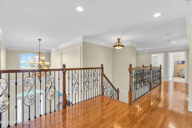 208 Imperial Ct, Lakewood, NJ 08701 - hallway with an upstairs landing, a chandelier, wood finished floors, recessed lighting, and crown molding
