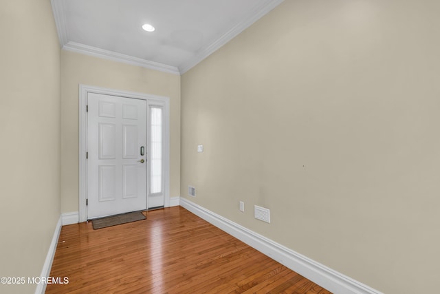 208 Imperial Ct, Lakewood, NJ 08701 - entrance foyer with ornamental molding, hardwood / wood-style flooring, and recessed lighting