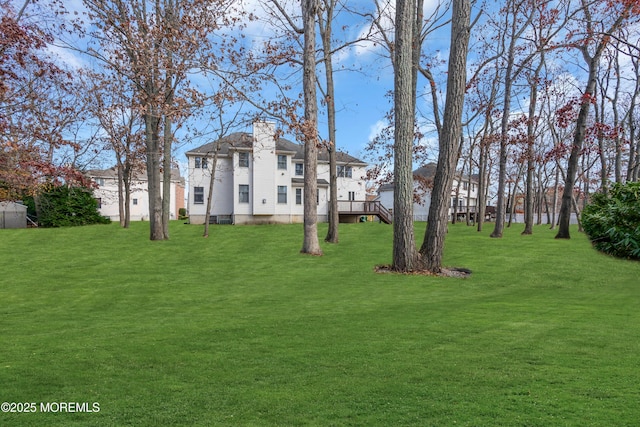 208 Imperial Ct, Lakewood, NJ 08701 - view of front of home with a chimney and a front lawn