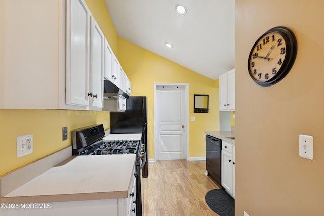 2015 Whitcomb Rd, Forked River, NJ 08731 - kitchen with stainless steel gas range, white cabinets, light wood-style floors, lofted ceiling, and light countertops