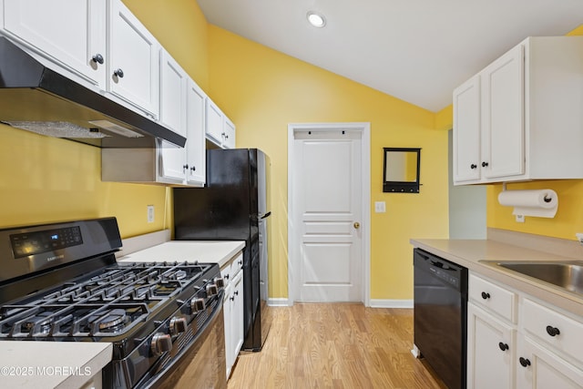 2015 Whitcomb Rd, Forked River, NJ 08731 - kitchen featuring black appliances, vaulted ceiling, light wood-style floors, under cabinet range hood, and white cabinets