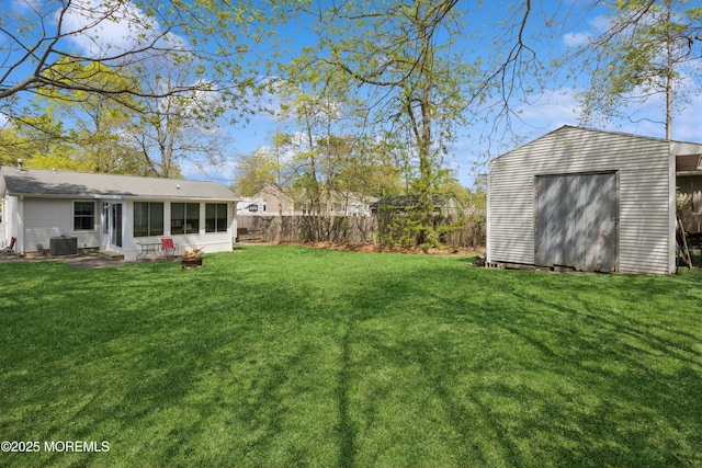 2015 Whitcomb Rd, Forked River, NJ 08731 - fenced backyard featuring a sunroom and a storage unit