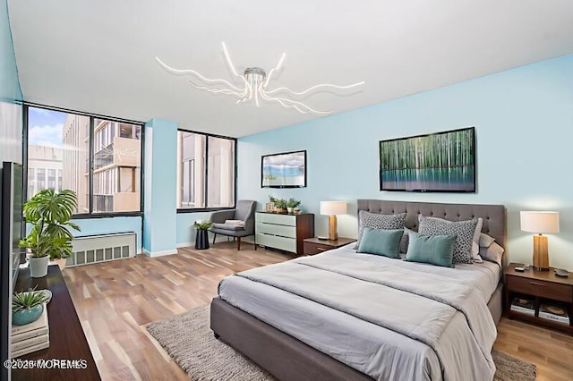 200 Winston Dr Unit 2921, Cliffside Park, NJ 07010 - bedroom with a chandelier and wood finished floors