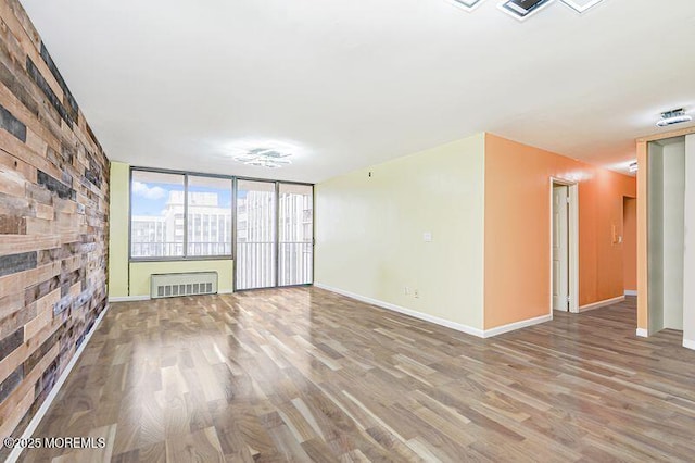 200 Winston Dr Unit 2921, Cliffside Park, NJ 07010 - unfurnished living room with wood finished floors and baseboards