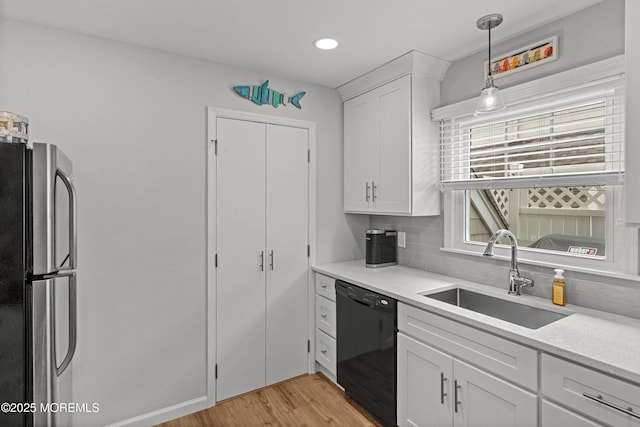 1301 SW Central Ave Unit A3, Seaside Park, NJ 08752 - kitchen with decorative backsplash, freestanding refrigerator, dishwasher, light wood-style flooring, and recessed lighting