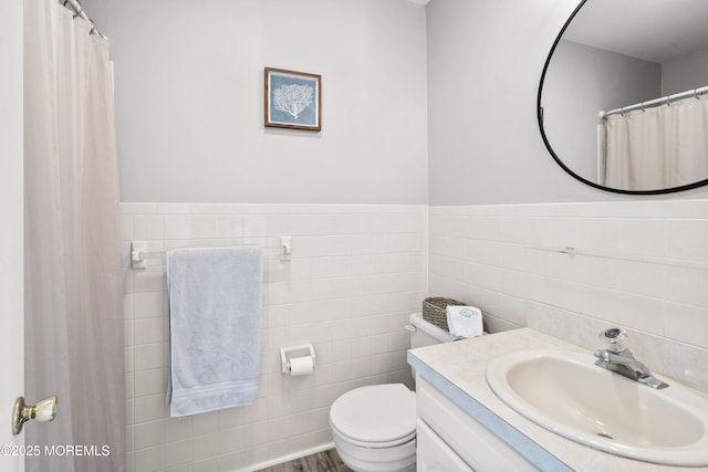 1301 SW Central Ave Unit A3, Seaside Park, NJ 08752 - full bathroom featuring tile walls, vanity, a shower with shower curtain, and wainscoting
