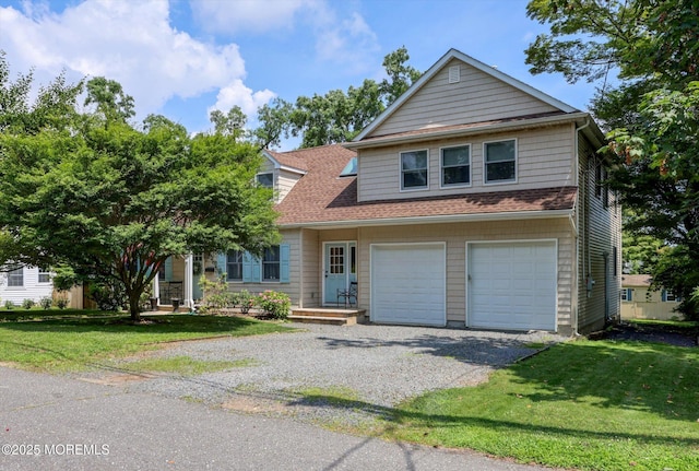 708 Lyman Ave, Brielle, NJ 08730 - view of front of house with an attached garage, gravel driveway, and a front yard