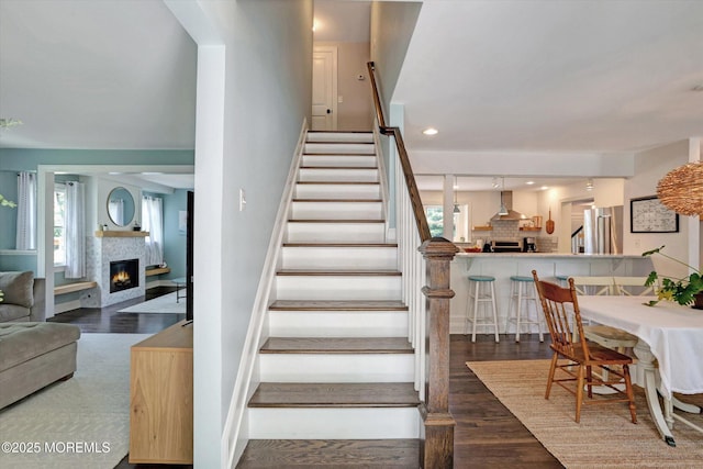 708 Lyman Ave, Brielle, NJ 08730 - stairway with a glass covered fireplace and wood finished floors