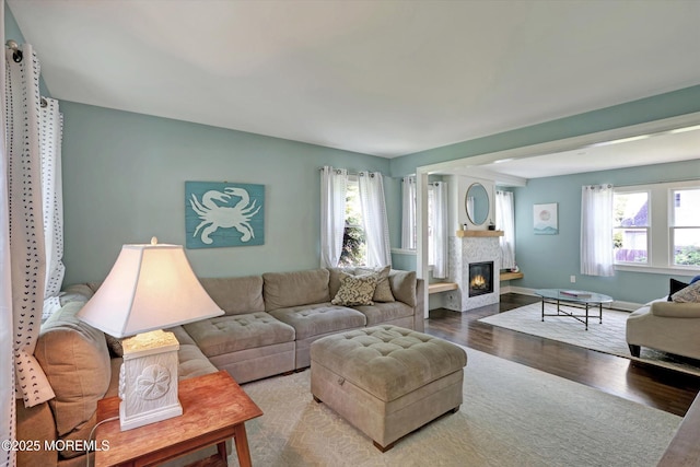 708 Lyman Ave, Brielle, NJ 08730 - living room with wood finished floors and a glass covered fireplace
