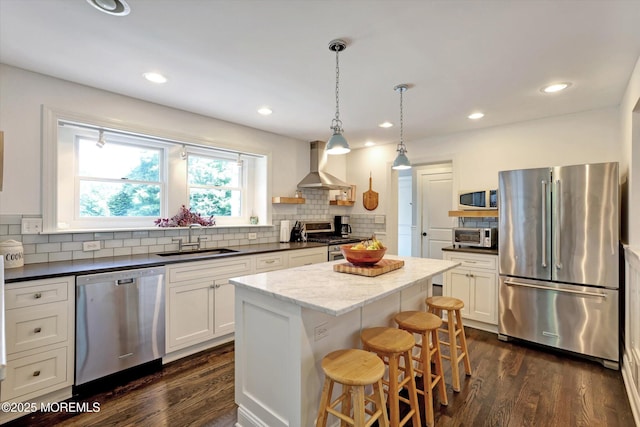 708 Lyman Ave, Brielle, NJ 08730 - kitchen with appliances with stainless steel finishes, backsplash, a center island, a kitchen bar, and recessed lighting