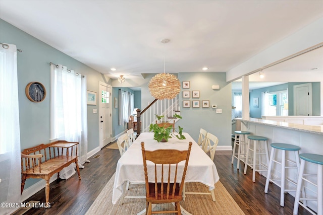 708 Lyman Ave, Brielle, NJ 08730 - dining space with stairs, dark wood-style floors, track lighting, and recessed lighting