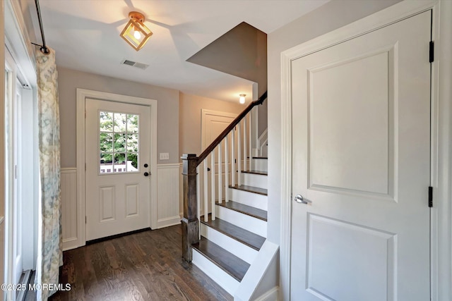 708 Lyman Ave, Brielle, NJ 08730 - entryway featuring dark wood-style flooring, wainscoting, and stairway