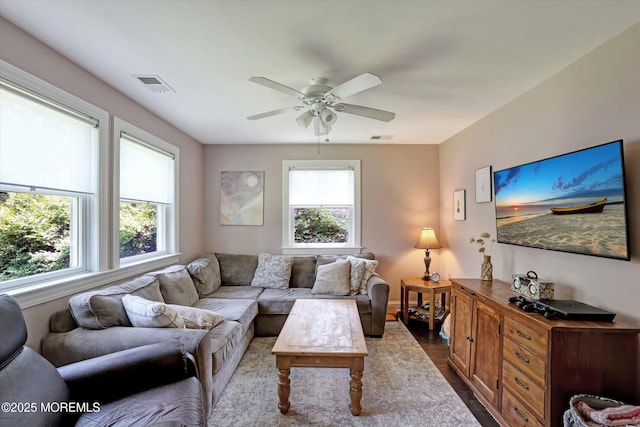 708 Lyman Ave, Brielle, NJ 08730 - living room featuring a ceiling fan and dark wood-style flooring