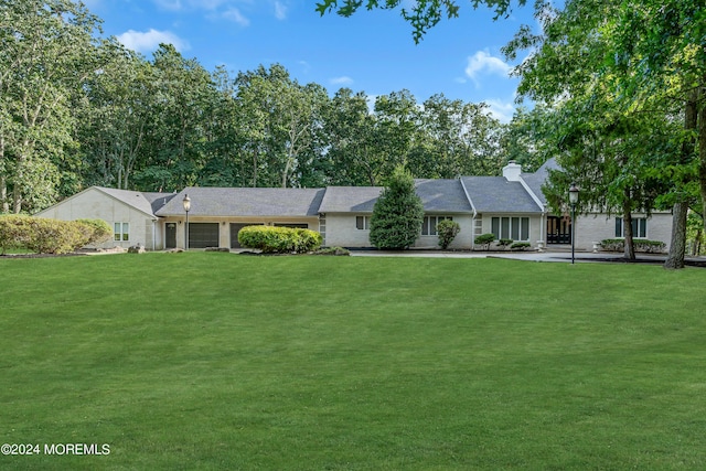 222 Bartley Rd, Jackson, NJ 08527 - ranch-style house featuring a front yard, a chimney, and a garage