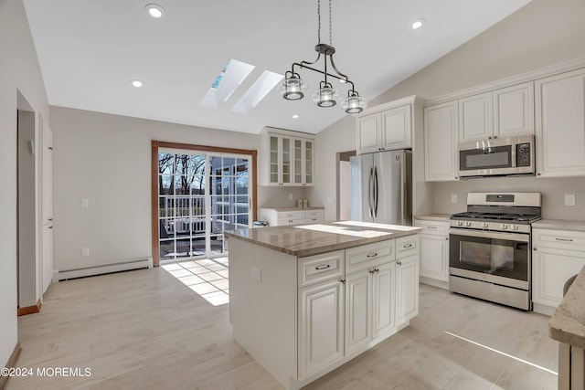 222 Bartley Rd, Jackson, NJ 08527 - kitchen with appliances with stainless steel finishes, a skylight, vaulted ceiling, glass insert cabinets, and a center island