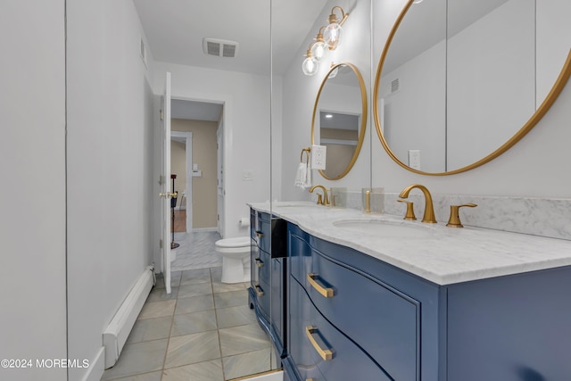 222 Bartley Rd, Jackson, NJ 08527 - full bath featuring a baseboard radiator, double vanity, and tile patterned flooring