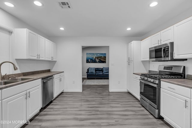222 Bartley Rd, Jackson, NJ 08527 - kitchen with stainless steel appliances, recessed lighting, white cabinets, and light wood-style floors