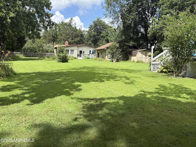 181 E Pleasant Grove Rd, Jackson, NJ 08527 - view of yard with a storage unit and view of scattered trees