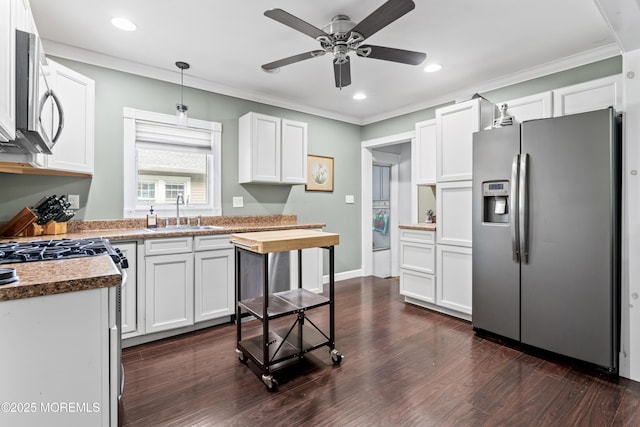 49 Highland Ave, Leonardo, NJ 07737 - kitchen featuring appliances with stainless steel finishes, dark wood-type flooring, ceiling fan, white cabinets, and crown molding