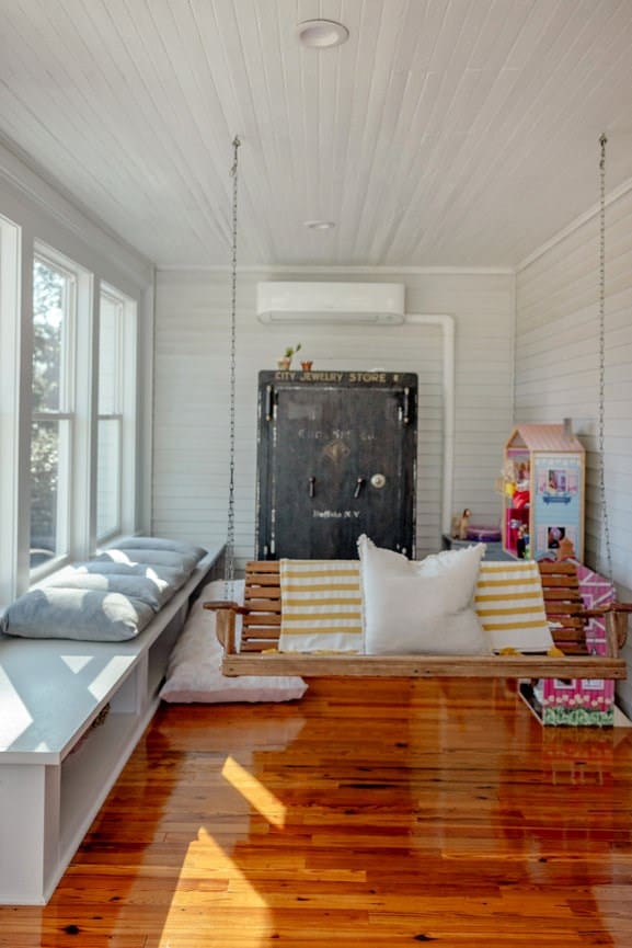 interior space with wood-type flooring, wood ceiling, and a wall unit AC