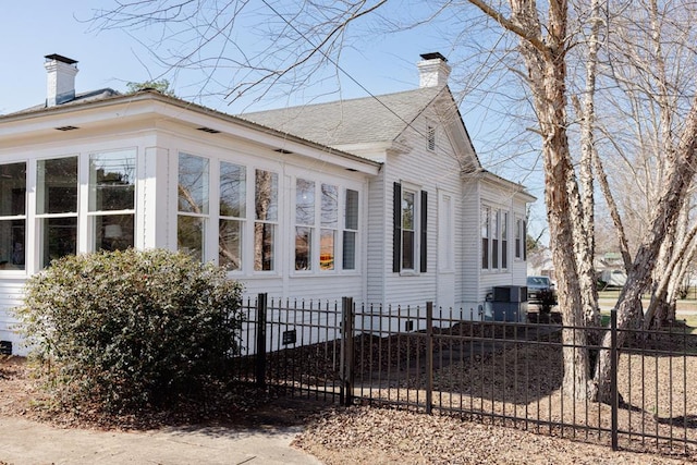 view of side of property featuring a sunroom