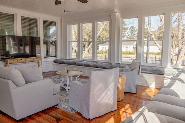 sunroom featuring ceiling fan