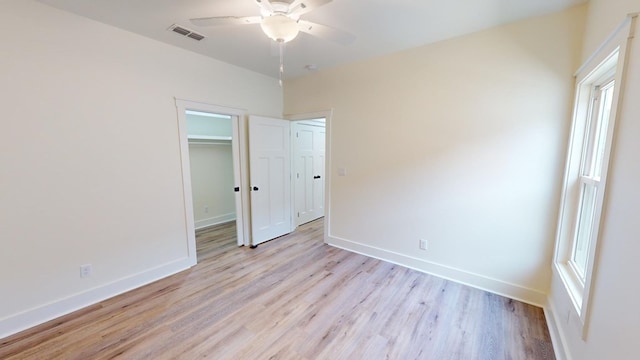 unfurnished bedroom with a closet, ceiling fan, and light hardwood / wood-style flooring