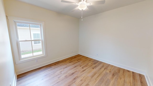 unfurnished room with ceiling fan, plenty of natural light, and light wood-type flooring