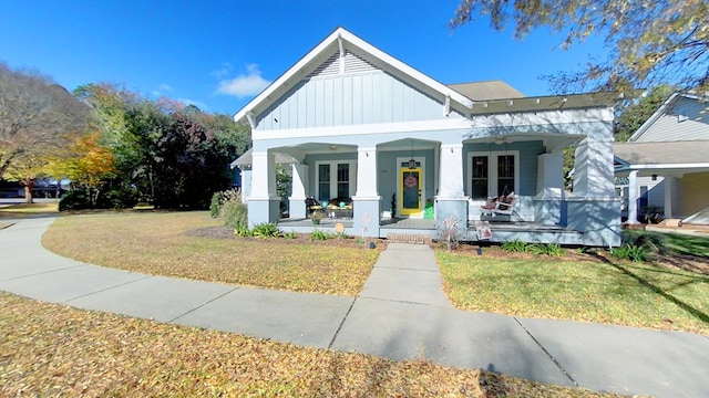 view of front of property with a porch and a front yard