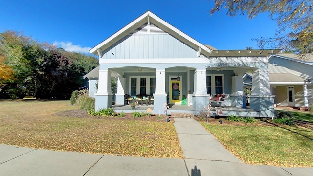 view of front of house with a front lawn and covered porch