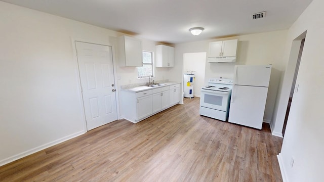 kitchen featuring white appliances, visible vents, light countertops, under cabinet range hood, and white cabinetry