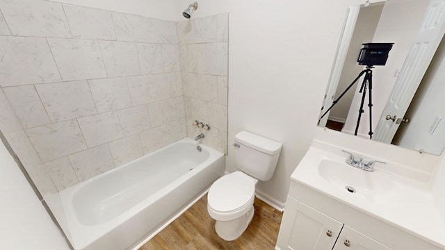 full bathroom featuring vanity, shower / tub combination, wood finished floors, and toilet